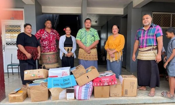 Principal and Deputy Principal of Tonga Side School with donation from the Noble Representative Office. 